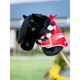 Black plush lemieux hobby horse with red and white flower sash red decorative blanket and floral accents