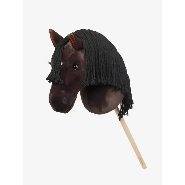 A plush dark brown lemieux hobby horse freya with black fringe mane and wooden stick handle for kids play