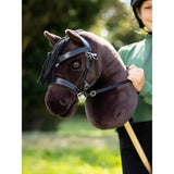 A plush dark brown lemieux hobby horse freya head with black braided mane and leather bridle for kids play