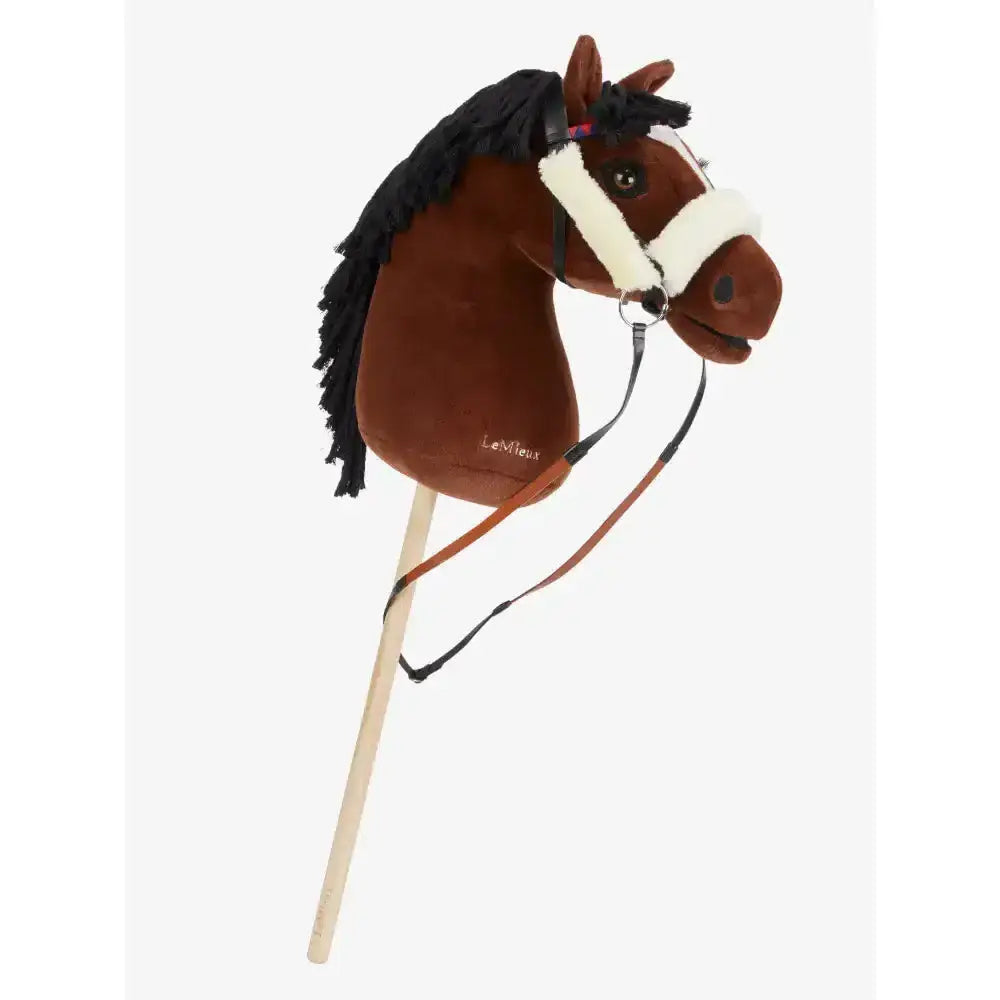 Brown plush lemieux hobby horse head with black fringed mane and white racing bridle on wooden stick for hobby horse racing