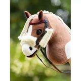 Plush brown and white horse with fluffy white mane wearing lemieux hobby horse racing bridle set black for racing fun