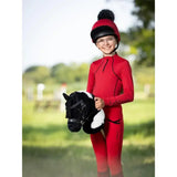 Red riding helmet with black brim and fluffy black pom-pom from lemieux hobby horse razzle collection
