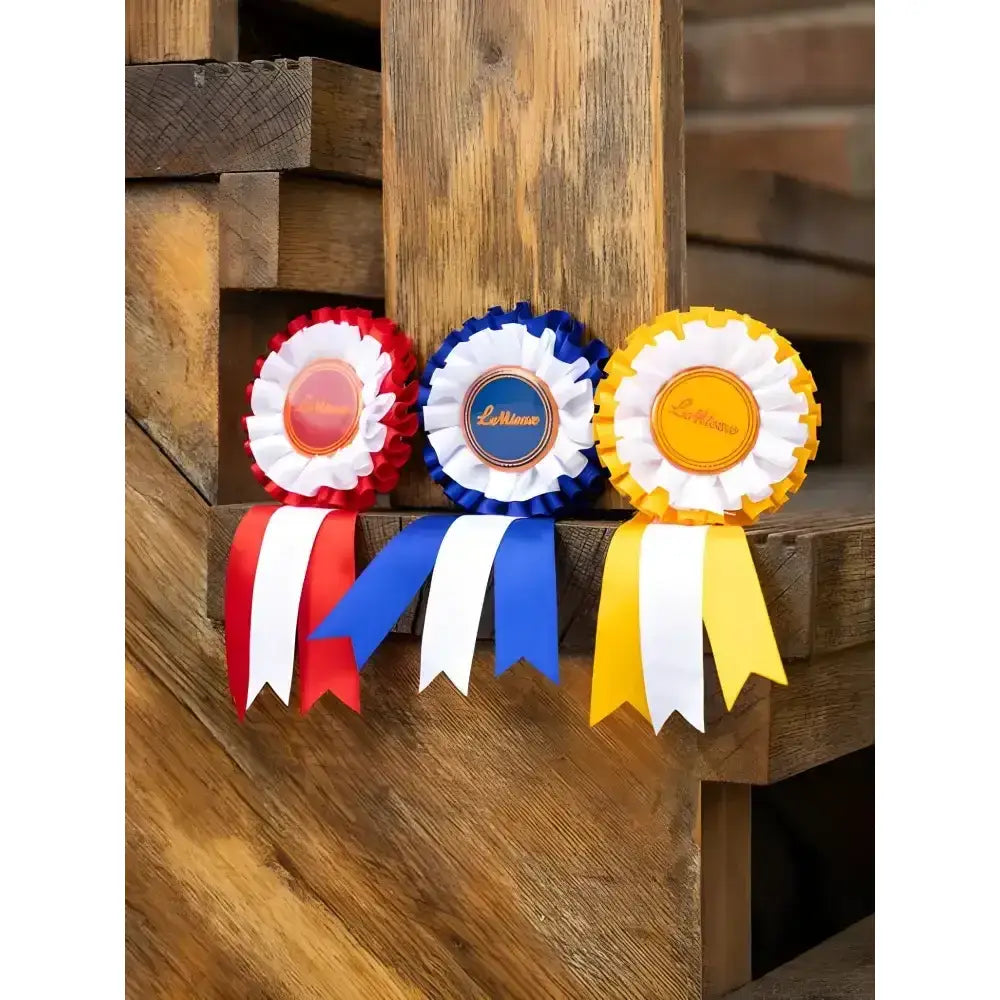 Three colorful lemieux hobby horse rosette winner’s rosettes in red-white-red blue-white-blue and yellow-white-yellow fabric