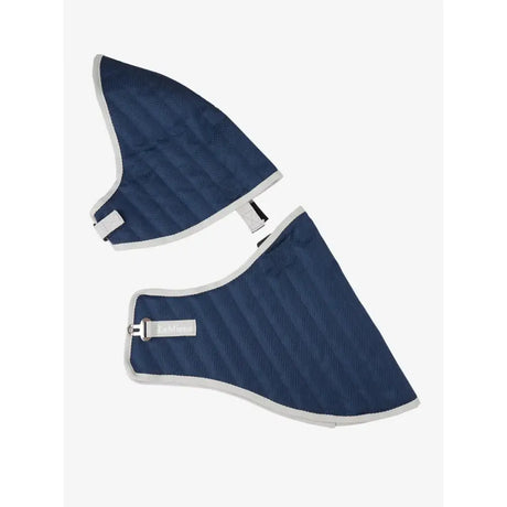 Navy blue quilted lemieux hobby horse stable rug with white trim and metal buckle perfect for horse stable use