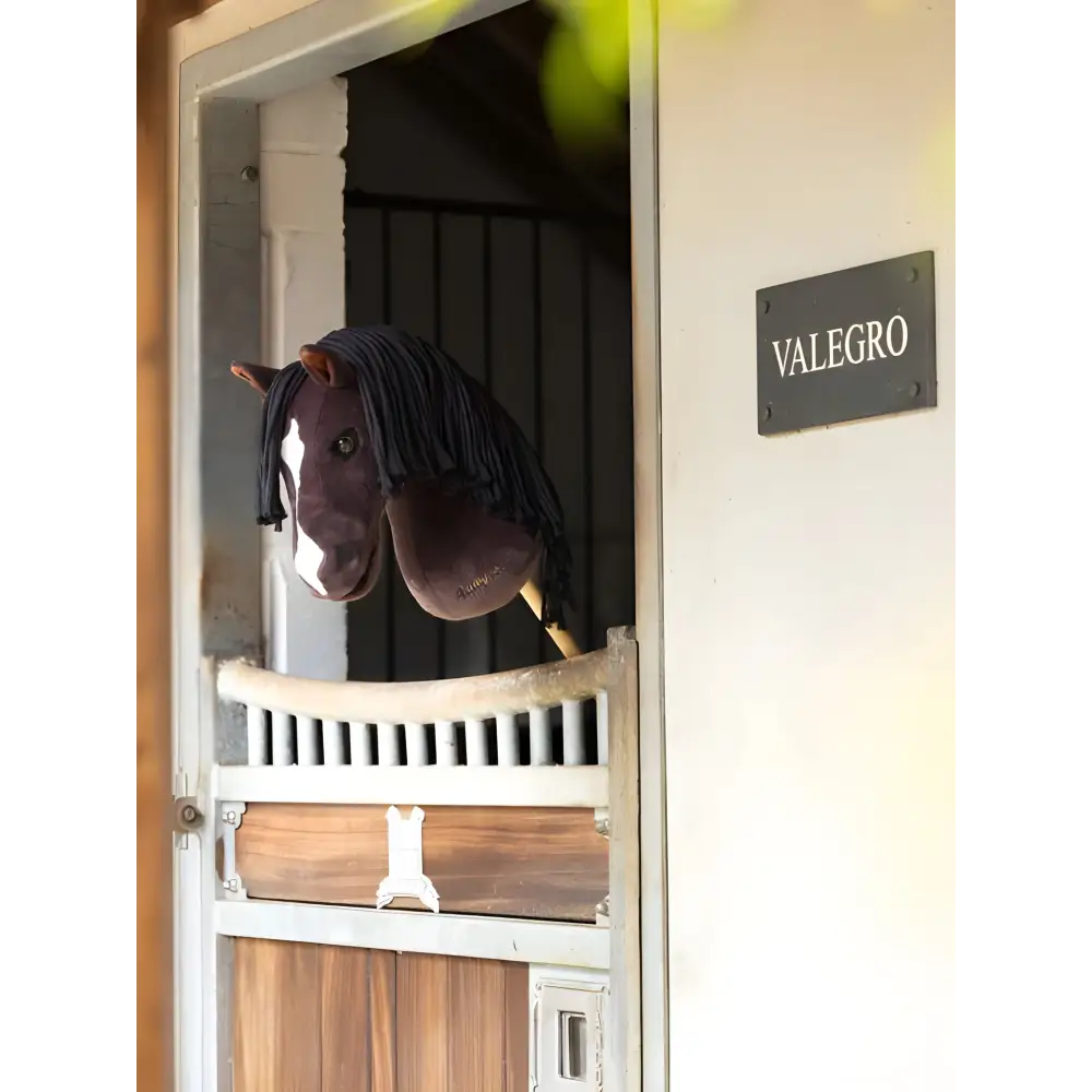 Plush Lemieux Hobby Horse Valegro head toy hanging over stable door