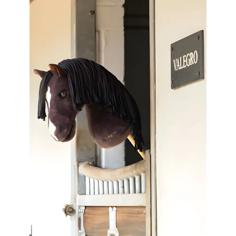 Plush horse head mounted on wall next to Valegro sign for Lemieux Hobby Horse