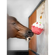 A whimsical pink and white lemieux horse toy cupcake with colorful polka dots made from natural husk hanging from a rope