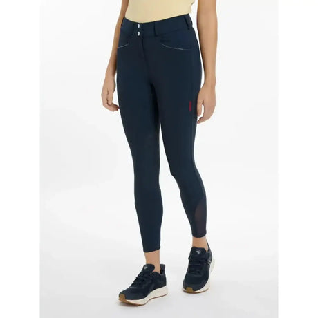 Navy blue lemieux imogen knee grip breeches with mesh panels and small red logo on the thigh for riding comfort