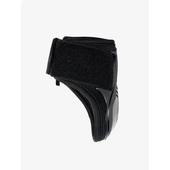 Black lemieux impact compliant fetlock boot with velcro strap and glossy moulded protective strike shell