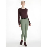 Maroon long-sleeved top with round neckline and fitted silhouette paired with lemieux isabelle seat breeches rosemary