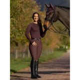 Maroon long-sleeved equestrian top with high neckline paired with lemieux isabelle knee grip breeches damson