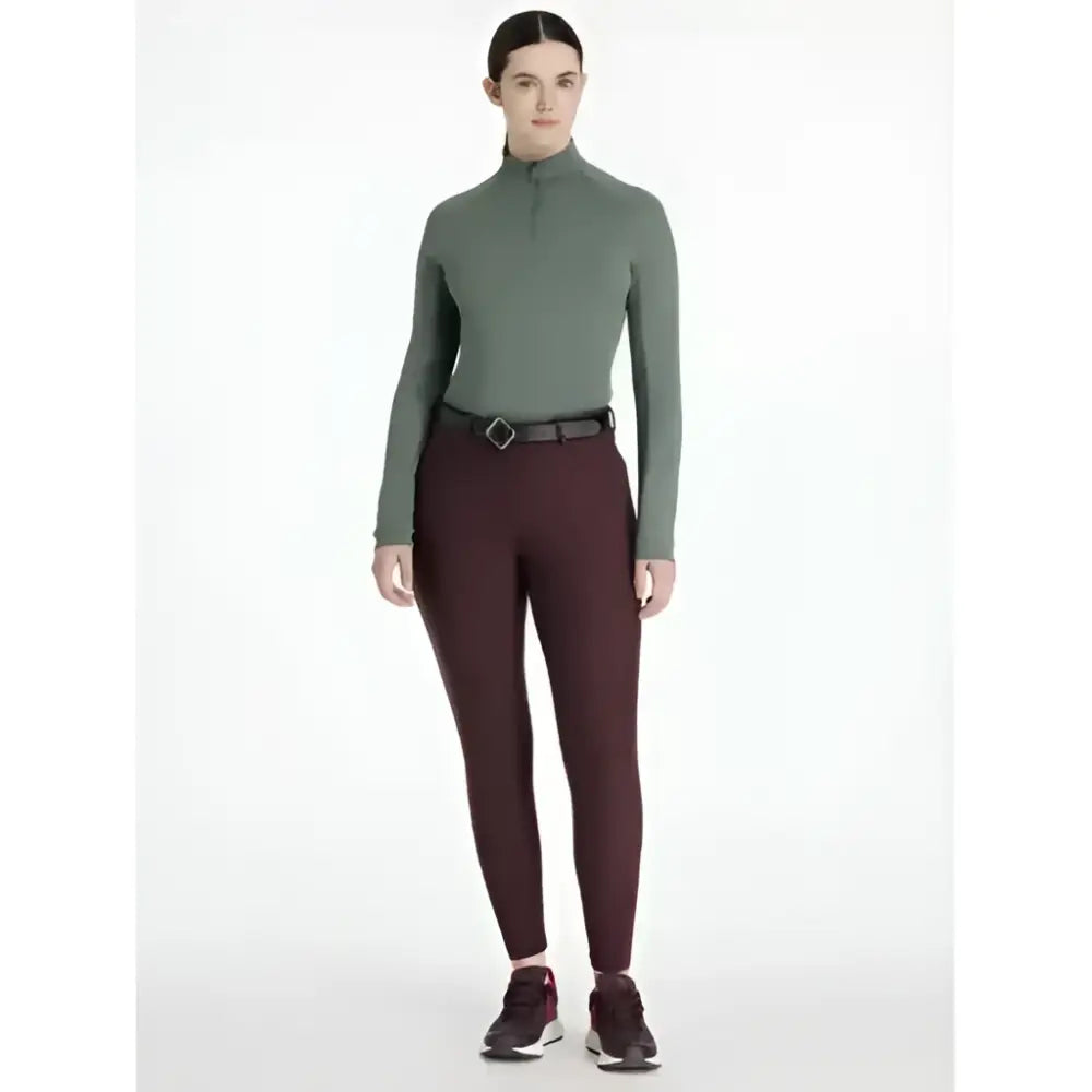 A sleek olive-green long-sleeved turtleneck top with quarter-zip collar perfect for lemieux isabelle knee grip breeches damson