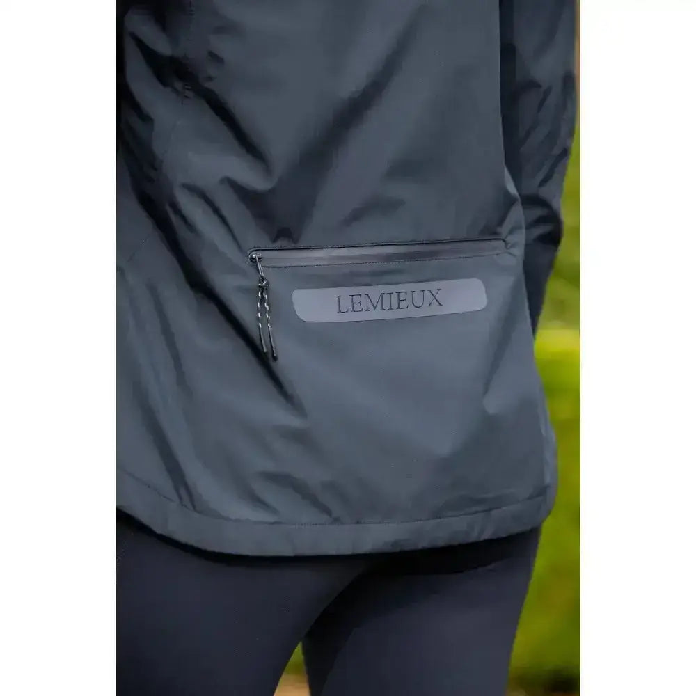 Dark gray lemieux isla short waterproof jacket with reflective zippered pocket and silver brand label