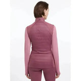 A mauve quilted puffer lemieux juliette gilet with high collar and long sleeves worn over matching leggings in rosewood