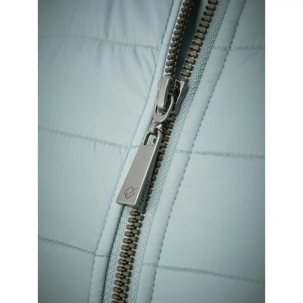 Metal zipper detail on light-colored quilted Lemieux Juliette Jacket Glacier fabric