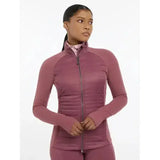 A mauve quilted zip-up athletic jacket with long sleeves and high collar lemieux juliette jacket rosewood