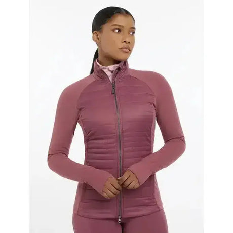 A mauve quilted zip-up athletic jacket with long sleeves and high collar lemieux juliette jacket rosewood
