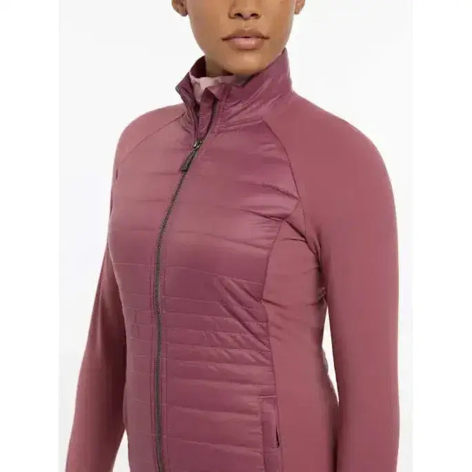 A mauve quilted zip-up jacket with a high collar and long sleeves lemieux juliette jacket rosewood