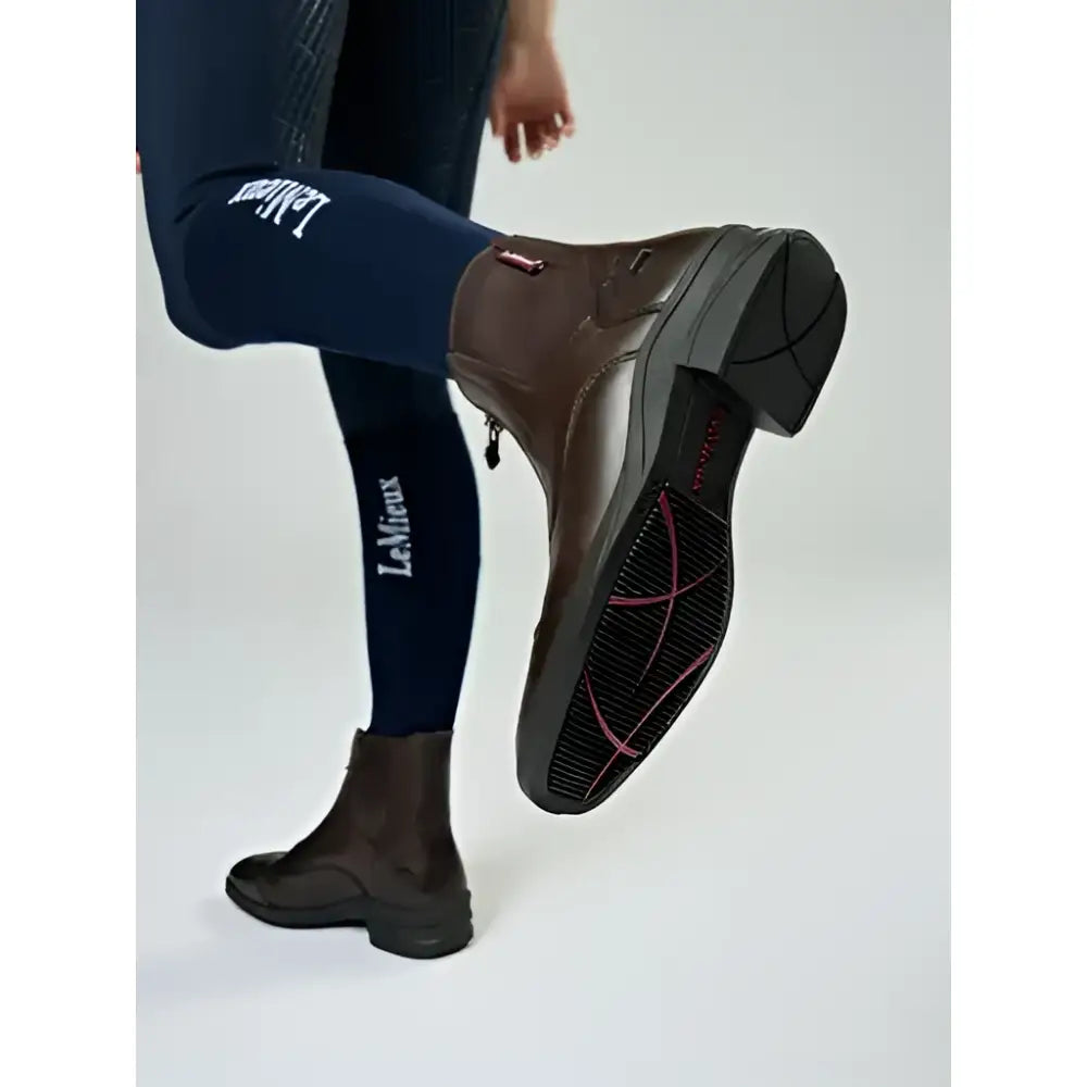 Brown leather lemieux junior zip paddock boot with side zipper and black rubber sole for riding use
