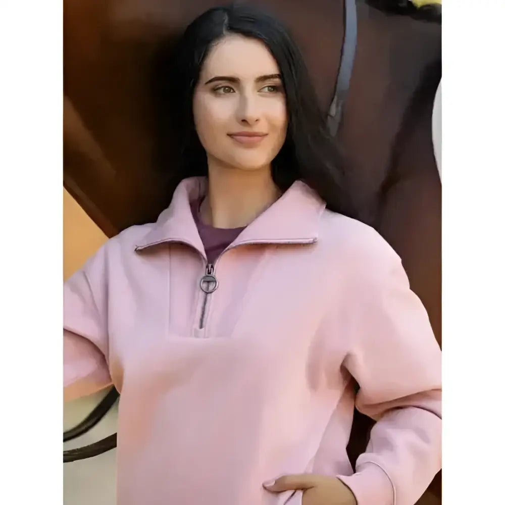 A soft pink lemieux keira quarter neck sweat with long sleeves and subtle stitching details