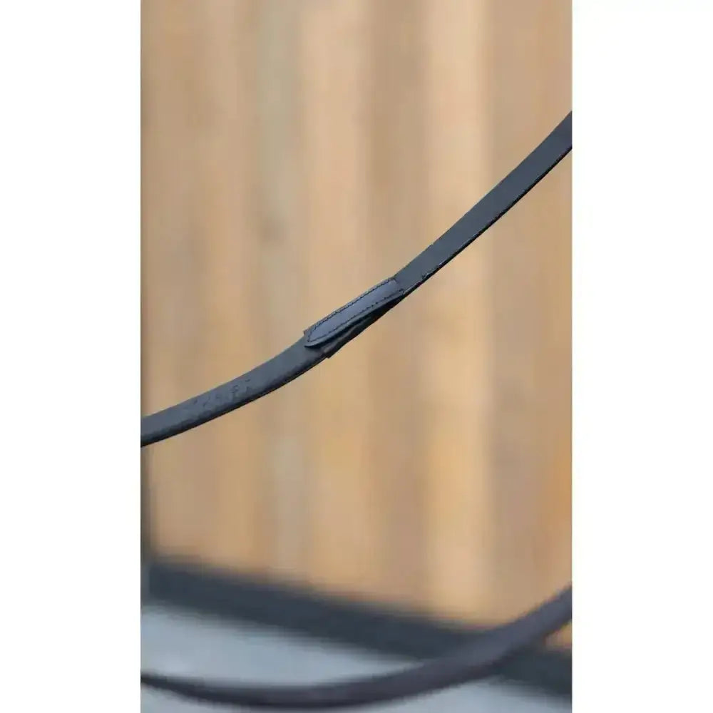 Black leather lemieux kris extreme rubber reins with smooth textured surface and reinforced stitching at the joint