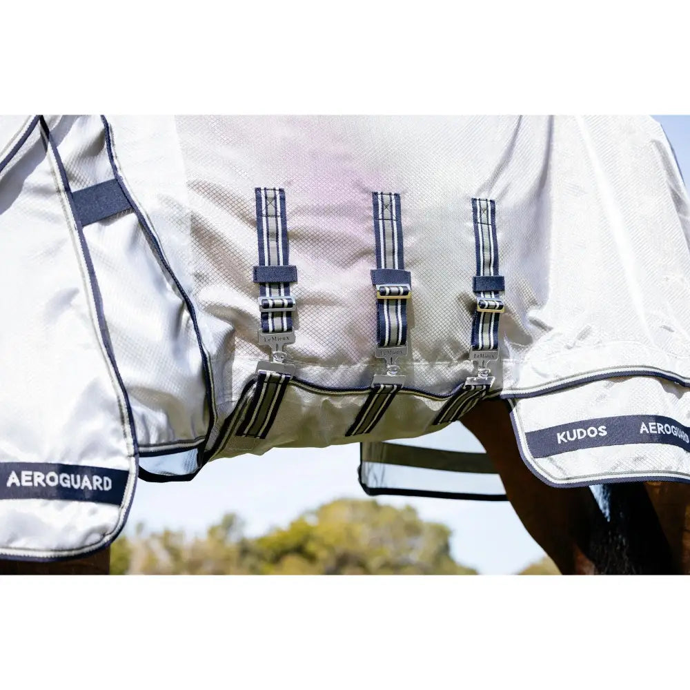 Silver and navy blue lemieux kudos aeroguard fly rug with mesh panels and adjustable straps for breathable horse protection
