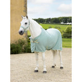 Light blue lemieux kudos bamboo horse blanket with subtle weave and matching straps for comfort and protection