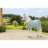 A light blue lemieux kudos bamboo cooler aqua horse blanket with soft texture and adjustable straps with a subtle logo