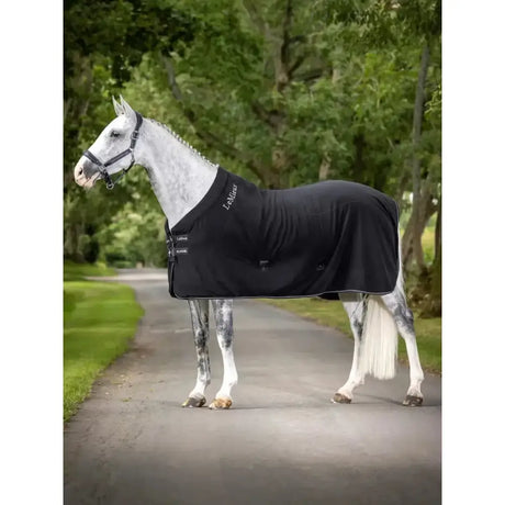 Black lemieux kudos fleece cooler rug with silver stitching and front closure made from soft polar fleece