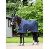 Navy blue lemieux kudos hybrid cooler horse blanket with white trim and adjustable straps in hybrid cooler navy style