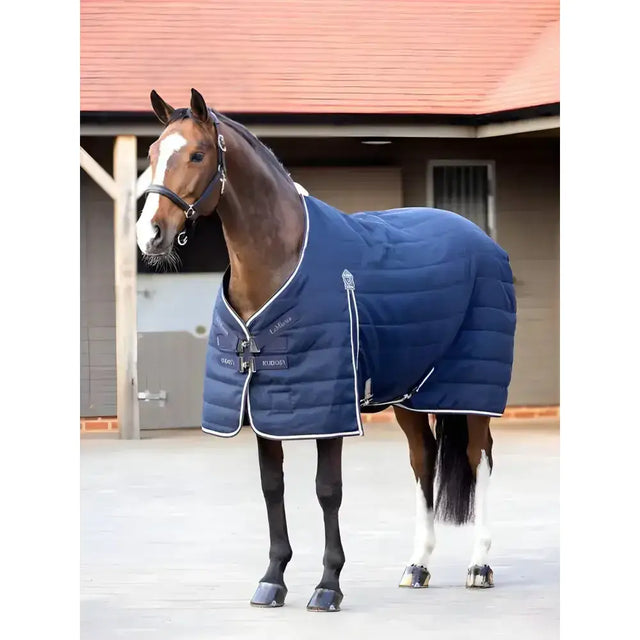 Navy blue lemieux kudos stable rug 100g with white trim rip stop outer and brand logo for horse use