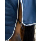 Blue quilted lemieux kudos stable rug 100g navy with white trim and black strap attachment made from rip-stop outer