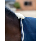 Blue denim lemieux kudos stable rug 50g with white fleece trim and fluffy white end for cozy stable use