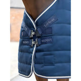 Navy blue quilted lemieux kudos stable rug 50g with white trim silver buckles and kudos1 branding