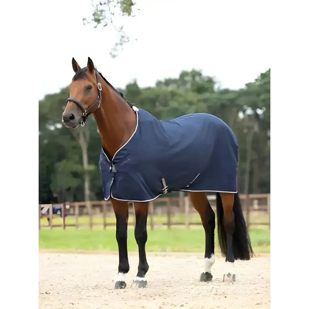 Navy blue lemieux kudos stable sheet with white trim and silver buckles designed for comfortable horse use