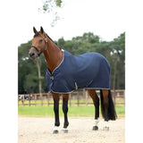 Navy blue lemieux kudos stable sheet with white trim and silver buckles designed for comfortable horse use