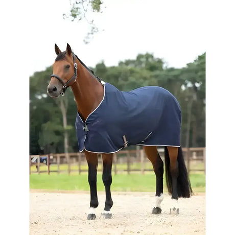 Navy blue lemieux kudos stable sheet with white trim and silver buckles designed for comfortable horse use