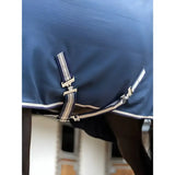 Navy blue lemieux kudos stable sheet with white and beige striped straps and silver buckles for horse use