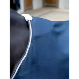 Blue lemieux kudos stable sheet navy with white trim and fluffy white strap for horse comfort and protection