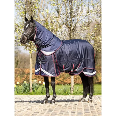 Navy blue lemieux kudos thermo layer turnout rug with maroon white accents and hooded neck for extra warmth