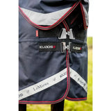 Dark navy lemieux kudos thermo layer turnout rug 300g with red silver trim black straps and reflective stripe on side