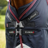 Navy blue lemieux kudos turnout rug 100g with red trim and silver buckles featuring lemieux branded straps