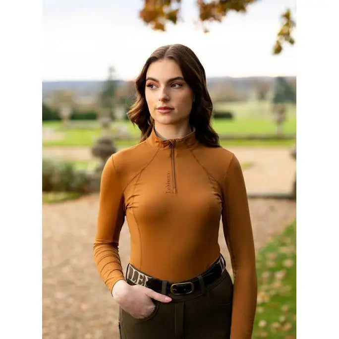 Woman in mustard turtleneck sweater from Lemieux Ladies Base Layer Ginger collection