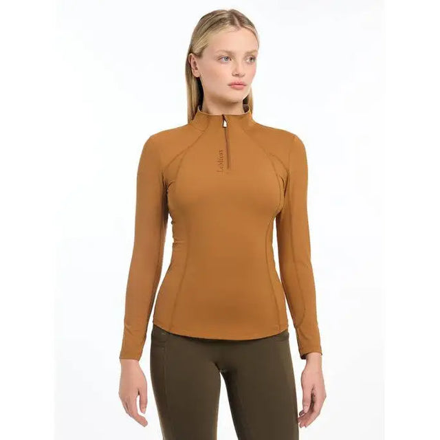 Caramel-colored long-sleeved Lemieux Ladies Base Layer Ginger with quarter-zip neckline