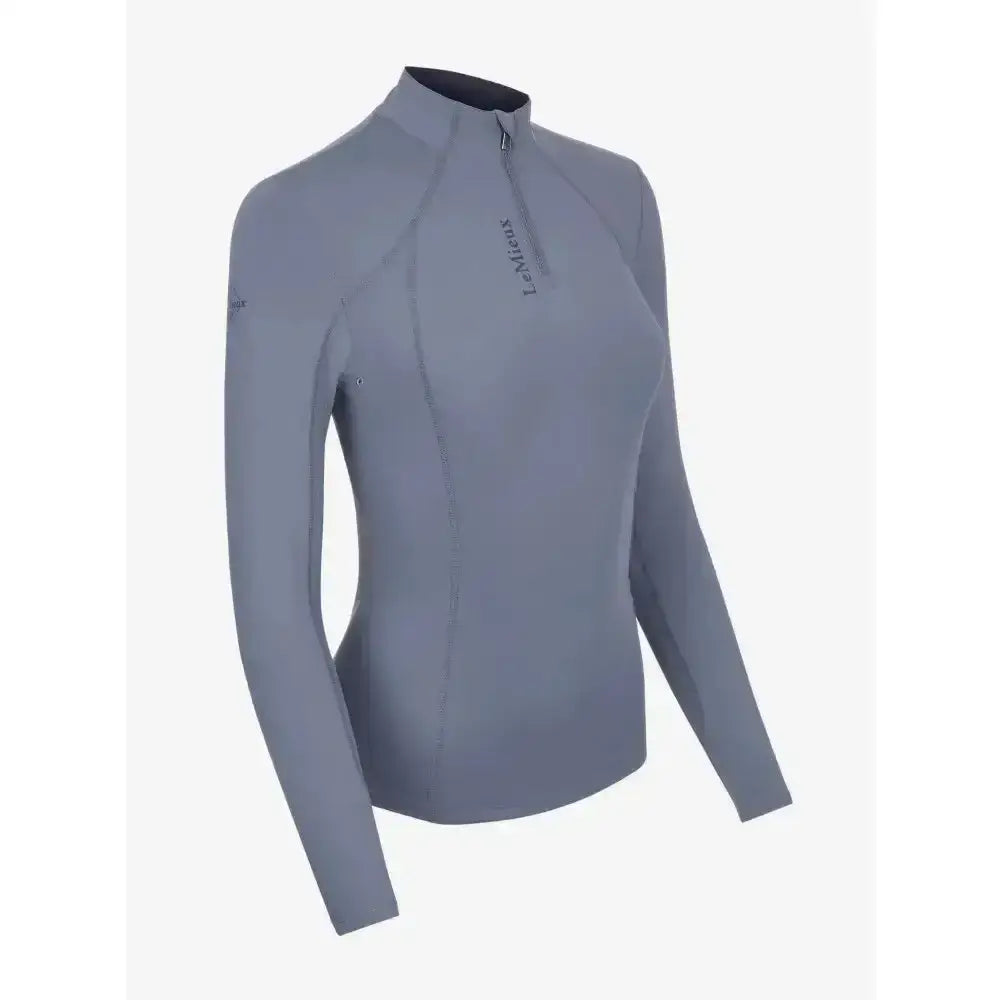 Gray long-sleeved lemieux ladies base layer jay blue top with high collar zipper and subtle chest branding