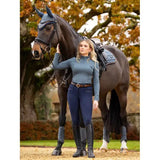 Dark brown horse with rider in Lemieux Ladies Base Layer Petrol equestrian attire