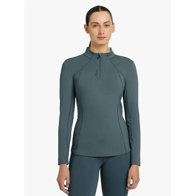 Teal long-sleeved athletic top from Lemieux Ladies Base Layer Petrol, featuring a quarter-zip collar