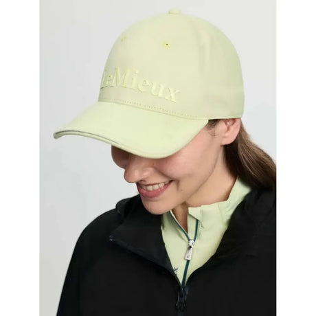 A pale green lara cap macaron in colourful cotton twill with structured shape and mieux embroidery on front