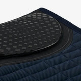 Dark blue quilted dressage pad navy with black rubberized cool grip surface featuring grid pattern lemieux le cool grip