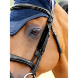 Black leather lemieux leather bridle with silver hardware and navy blue mesh head covering bridle blinkers black